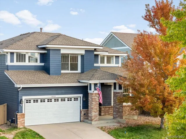 a front view of a house with yard