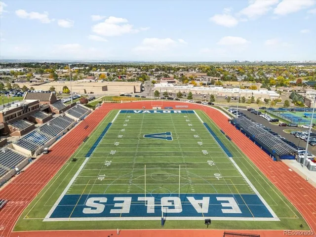 an aerial view of a play ground with lots of swings and slides