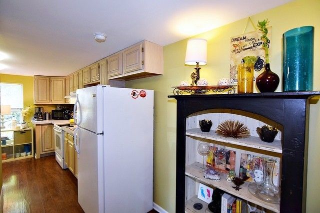 313 East State Street Geneva, IL 60134 - Photo 12 of 31 a kitchen with stainless steel appliances a stove a refrigerator and a cabinets