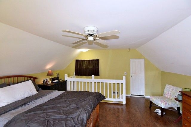 313 East State Street Geneva, IL 60134 - Photo 17 of 31 a bedroom with a bed and a flat screen tv