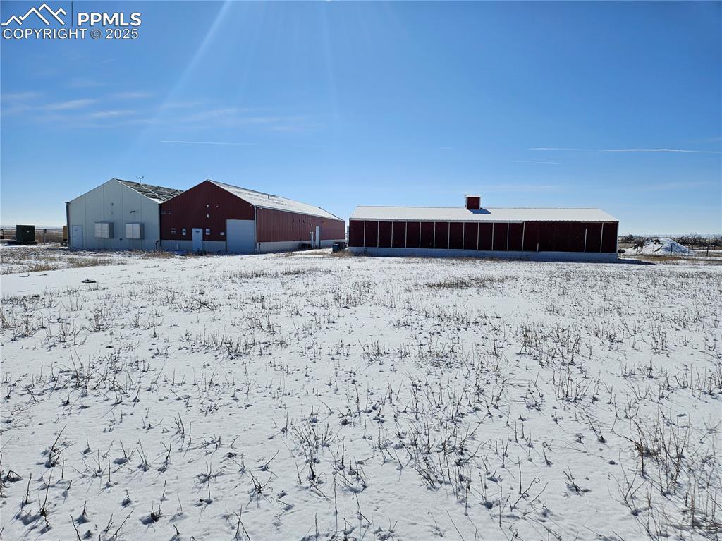 40444 Bush Road Avondale, CO 81022 - Photo 8 of 12 a view of wooden house with a yard