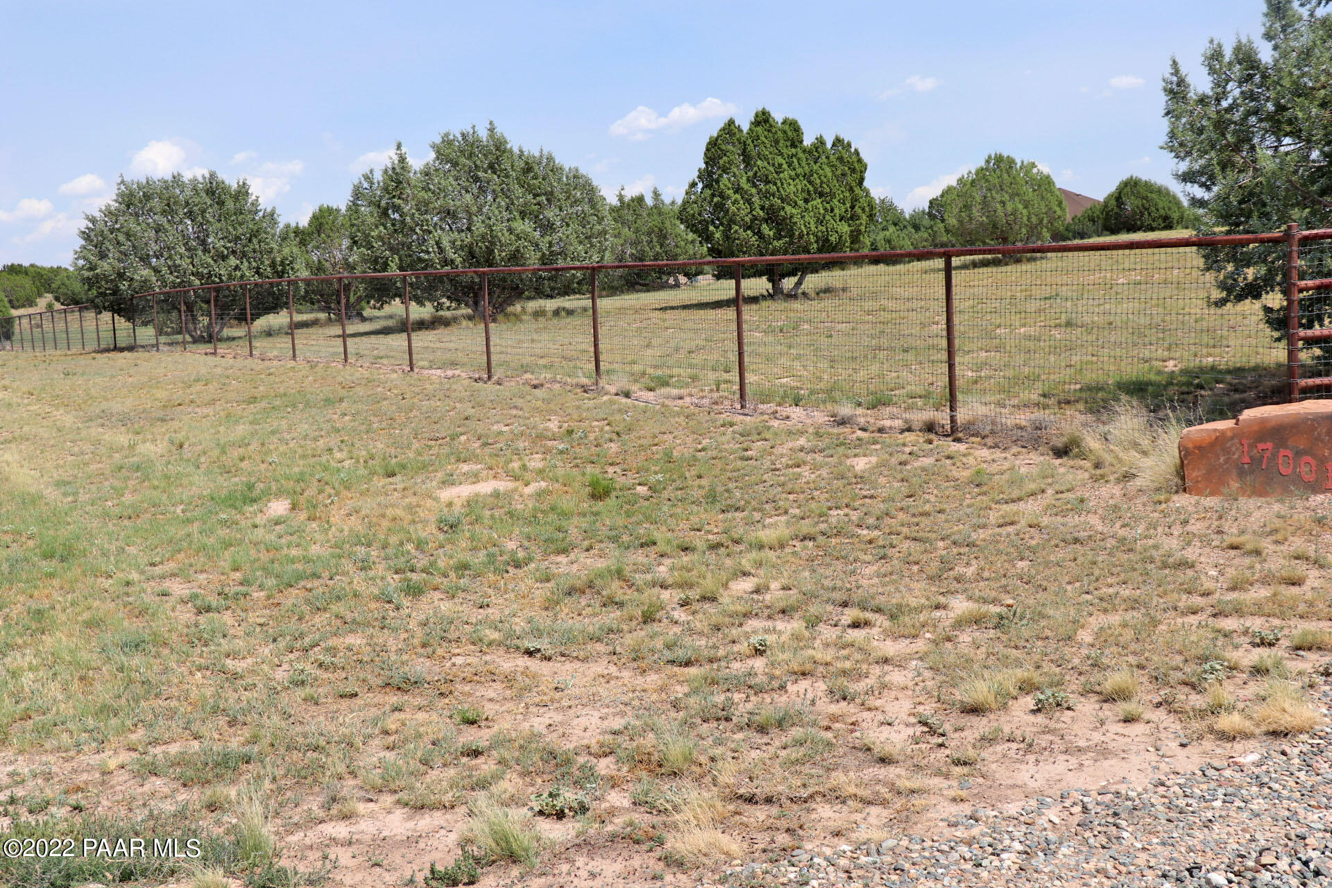 17001 Crossroads Ranch Road Prescott, AZ 86305 - Photo 49 of 54 a view of a yard with wooden fence