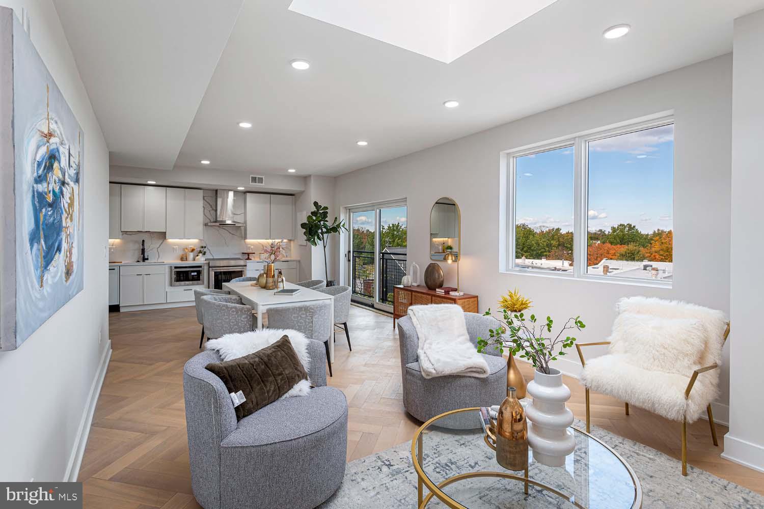 1516 East Capitol Street Northeast, Unit F Washington, DC 20003 - Photo 13 of 53 a living room with furniture and a large window