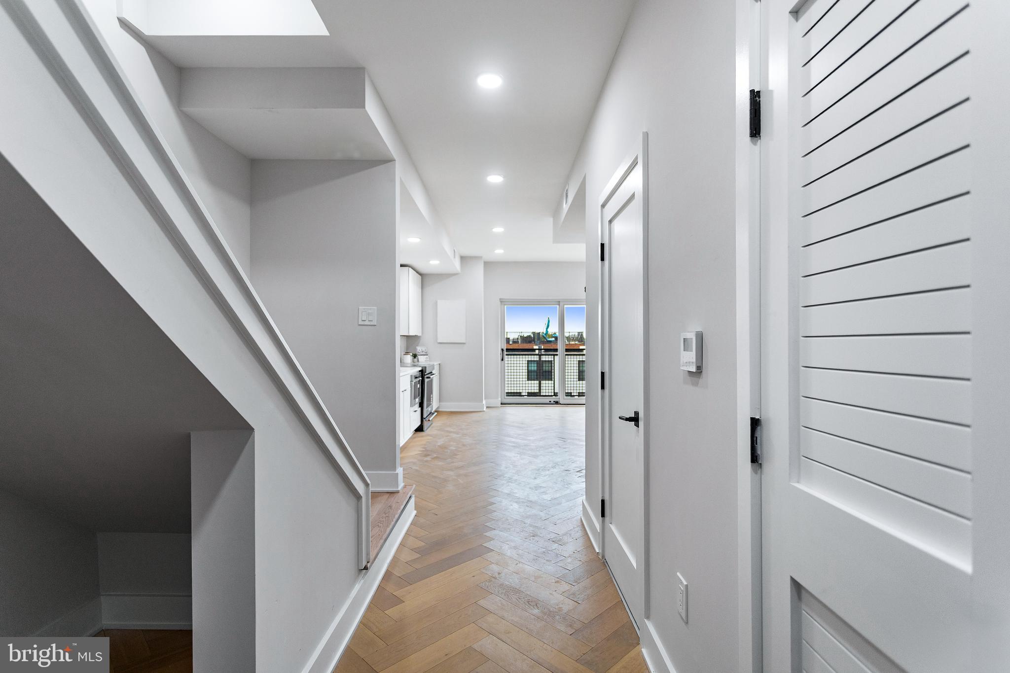 1516 East Capitol Street Northeast, Unit F Washington, DC 20003 - Photo 18 of 53 a view of a hallway with a dining table