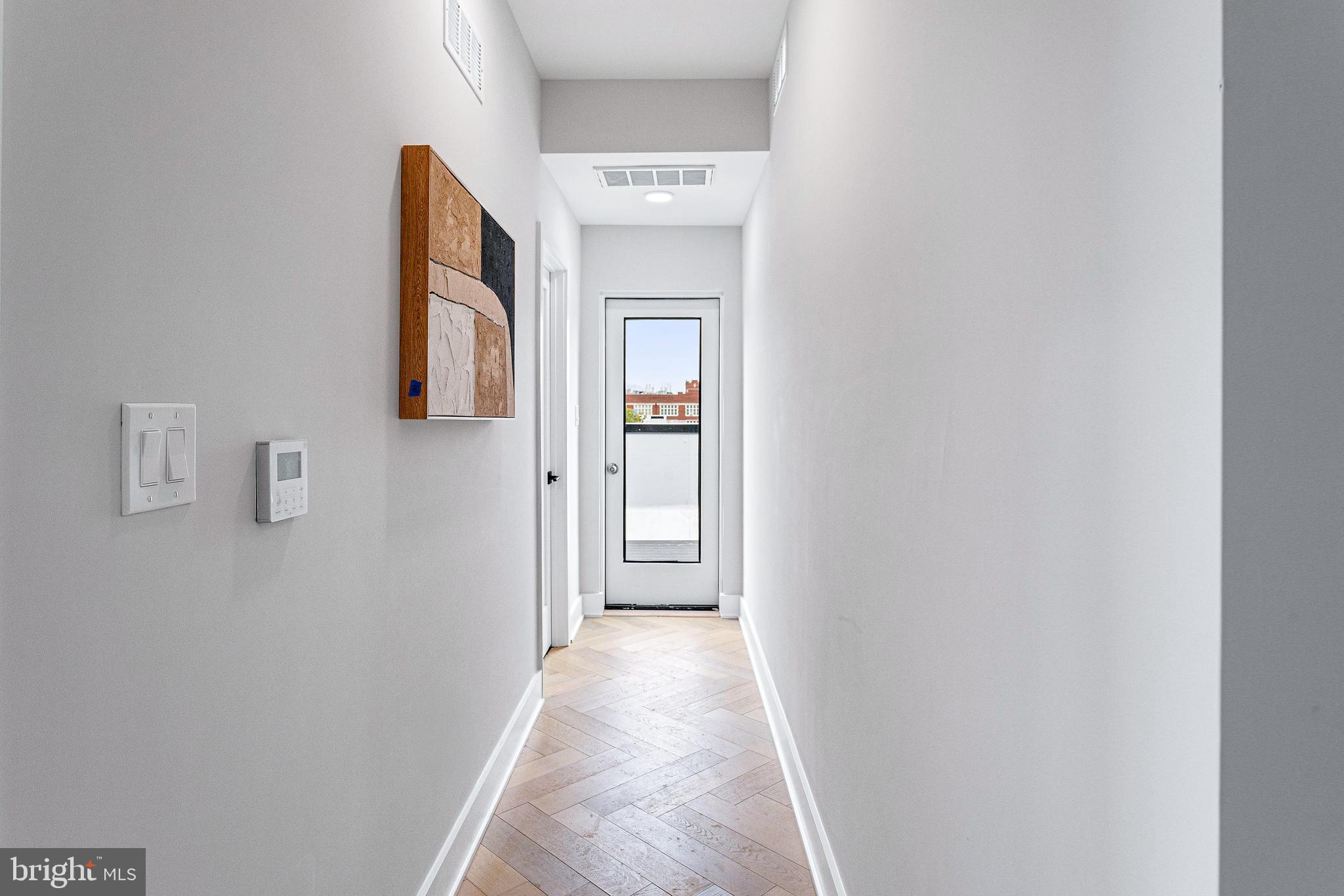 1516 East Capitol Street Northeast, Unit F Washington, DC 20003 - Photo 33 of 53 a view of a hallway with wooden floor