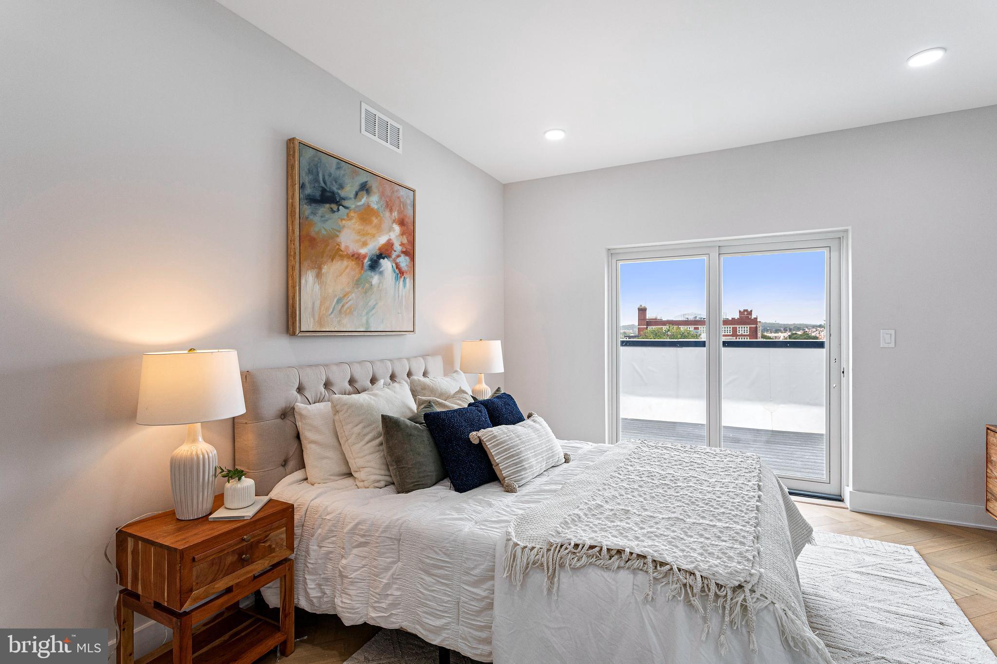 1516 East Capitol Street Northeast, Unit F Washington, DC 20003 - Photo 34 of 53 a bedroom with bed and night stand