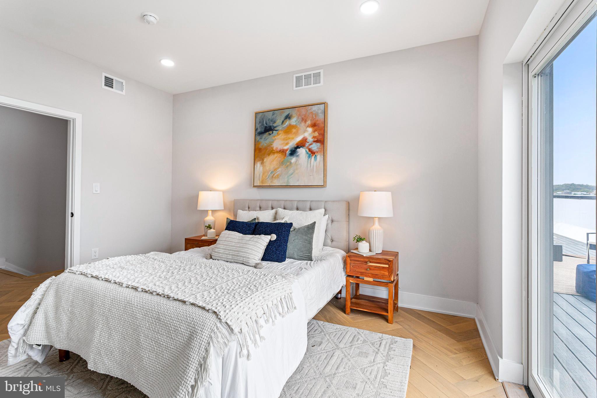 1516 East Capitol Street Northeast, Unit F Washington, DC 20003 - Photo 36 of 53 a bedroom with a bed and a painting on the wall