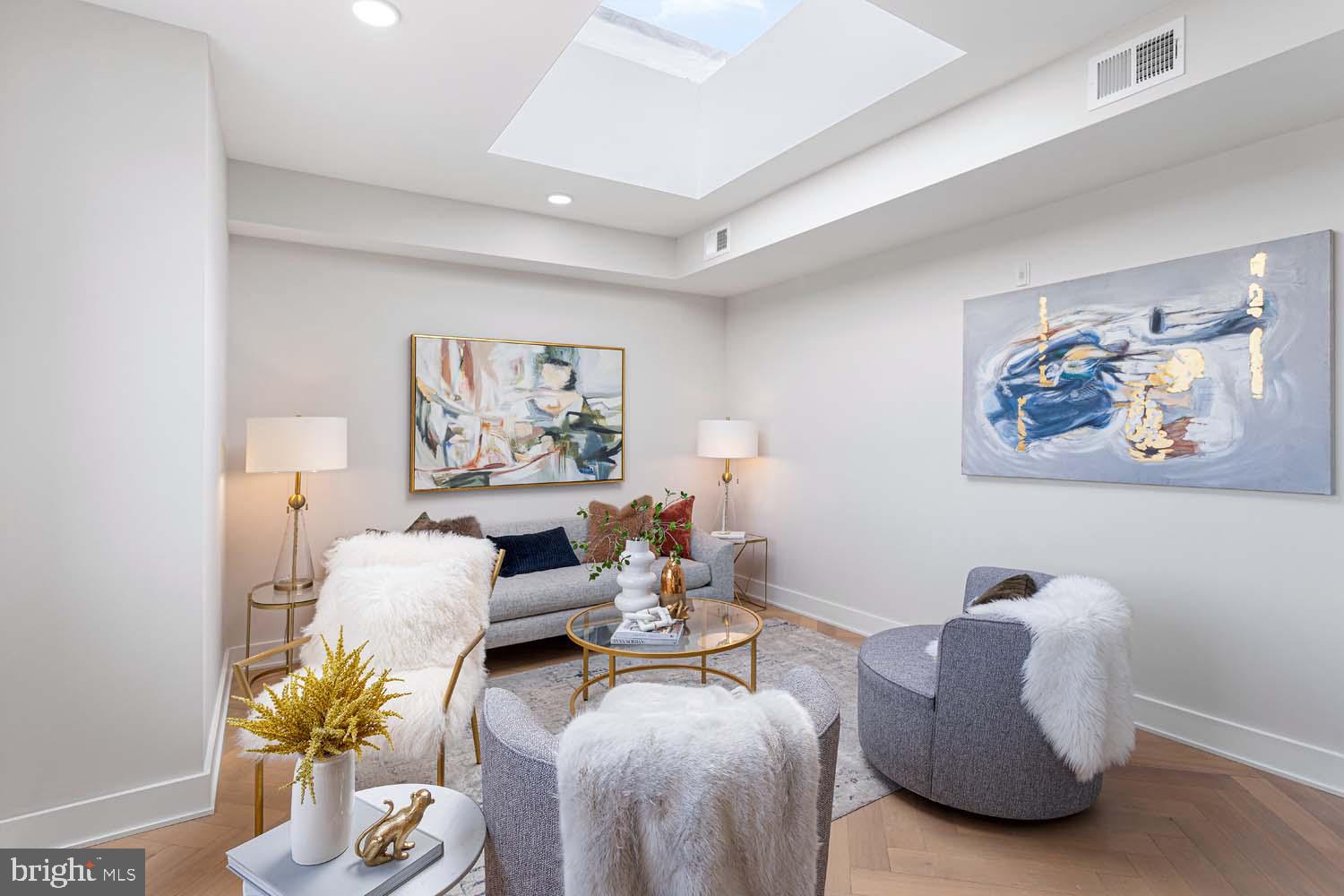 1516 East Capitol Street Northeast, Unit F Washington, DC 20003 - Photo 9 of 53 a living room with furniture flowers and a window