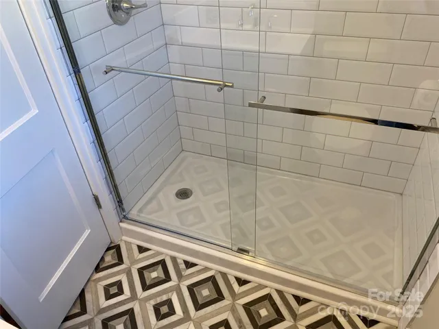 an empty room with wooden floor and closet