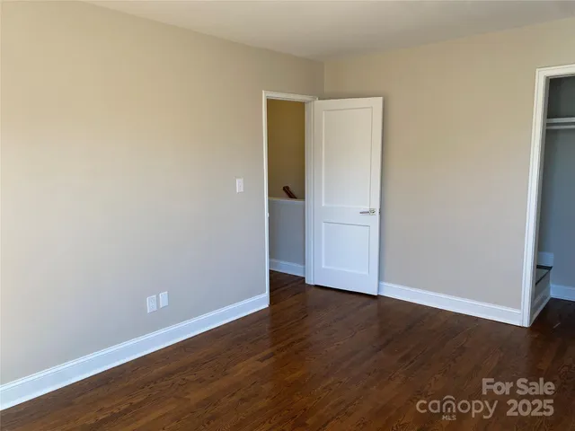 a view of road with residential houses