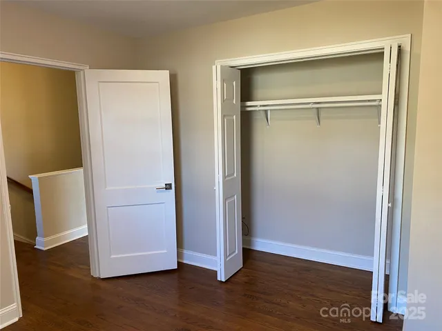 a view of yard with swimming pool and trees