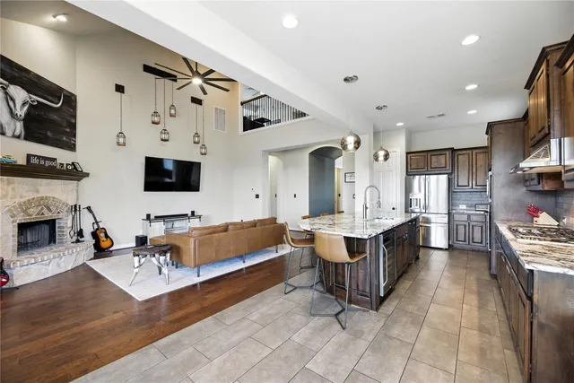 a living room with fireplace furniture and a flat screen tv