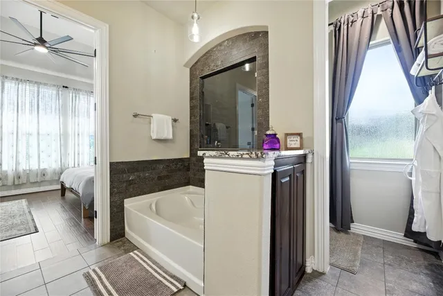 a bathroom with a sink a bathtub and a shower
