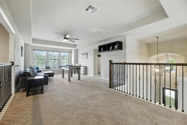 a livingroom with furniture and floor to ceiling window