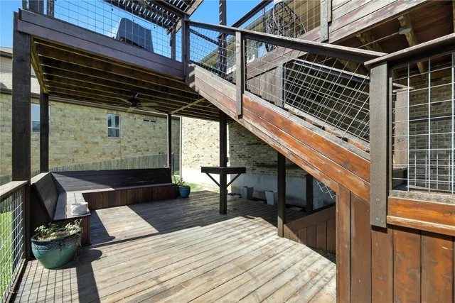 a balcony view with a couple of couches and wooden floor