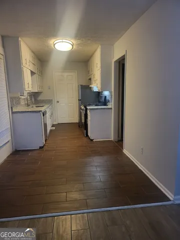 a kitchen with a sink and cabinets