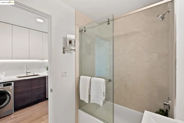 a bathroom with a shower and a sink