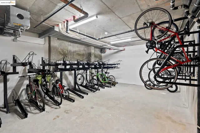 a view of a hallway with wooden floor and a chair