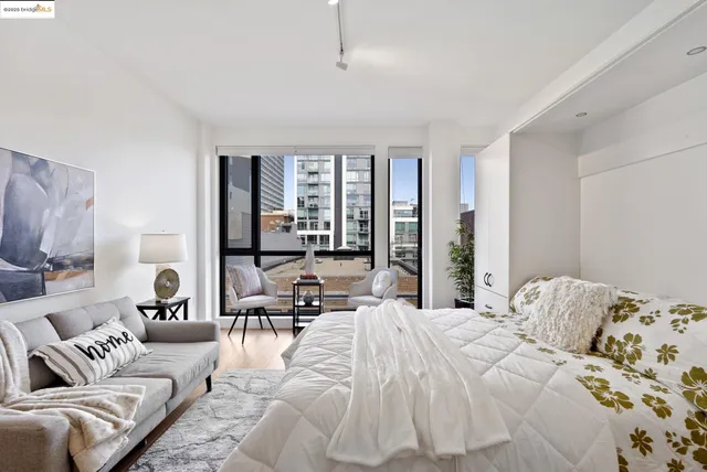 a bedroom with a bed and glass window