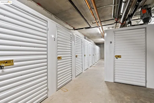 a front view of a residential apartment building with a yard