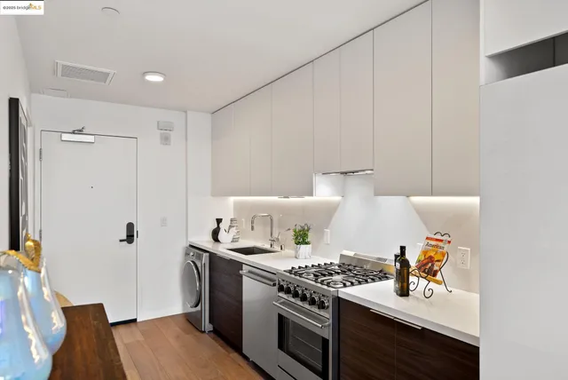a kitchen with a stove and a refrigerator