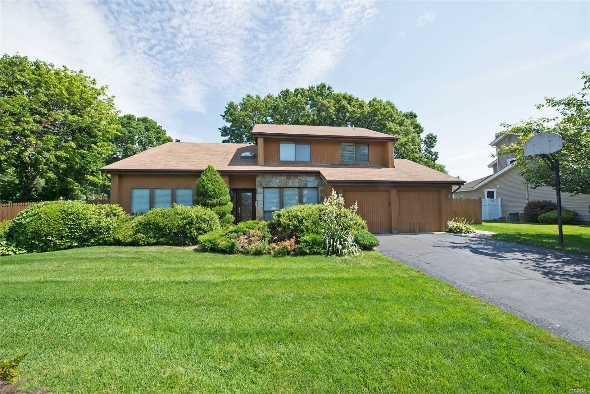 6 Chardonnay Road Commack, NY 11725 - Photo 1 of 1 a front view of a house with a yard
