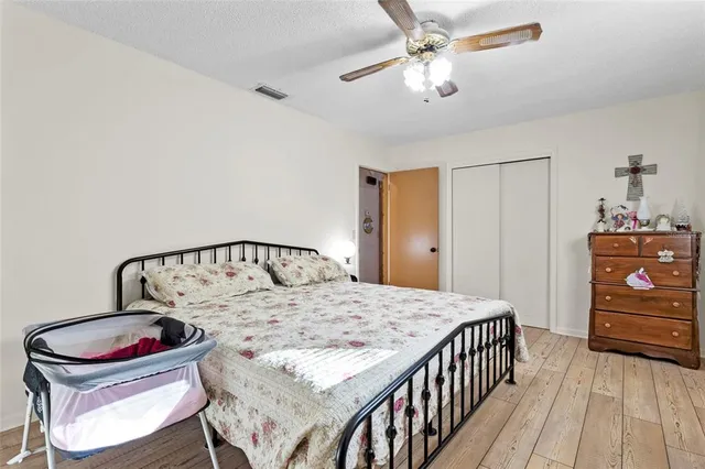 a bedroom with a bed and dresser