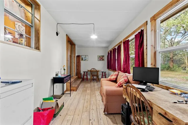 a bedroom with a bed and a desk