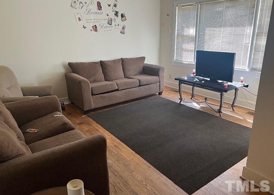 99 Susan Street, Unit 1 & 2 Clinton, NC 28328 - Photo 3 of 9 a living room with furniture and a window