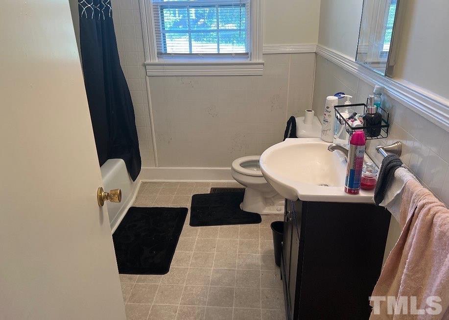 99 Susan Street, Unit 1 & 2 Clinton, NC 28328 - Photo 7 of 9 a bathroom with a sink and a mirror