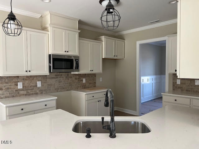 18 Alex Acres Way Selma, NC 27576 - Photo 5 of 13 a kitchen with stainless steel appliances kitchen island granite countertop a sink and a stove top oven