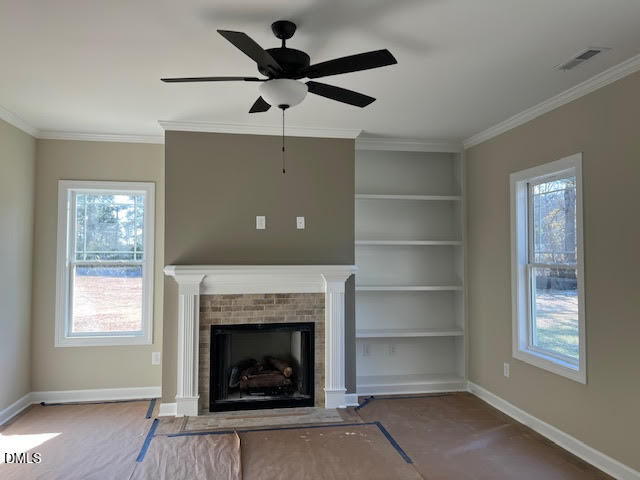 18 Alex Acres Way Selma, NC 27576 - Photo 8 of 13 a living room with a fireplace and a window