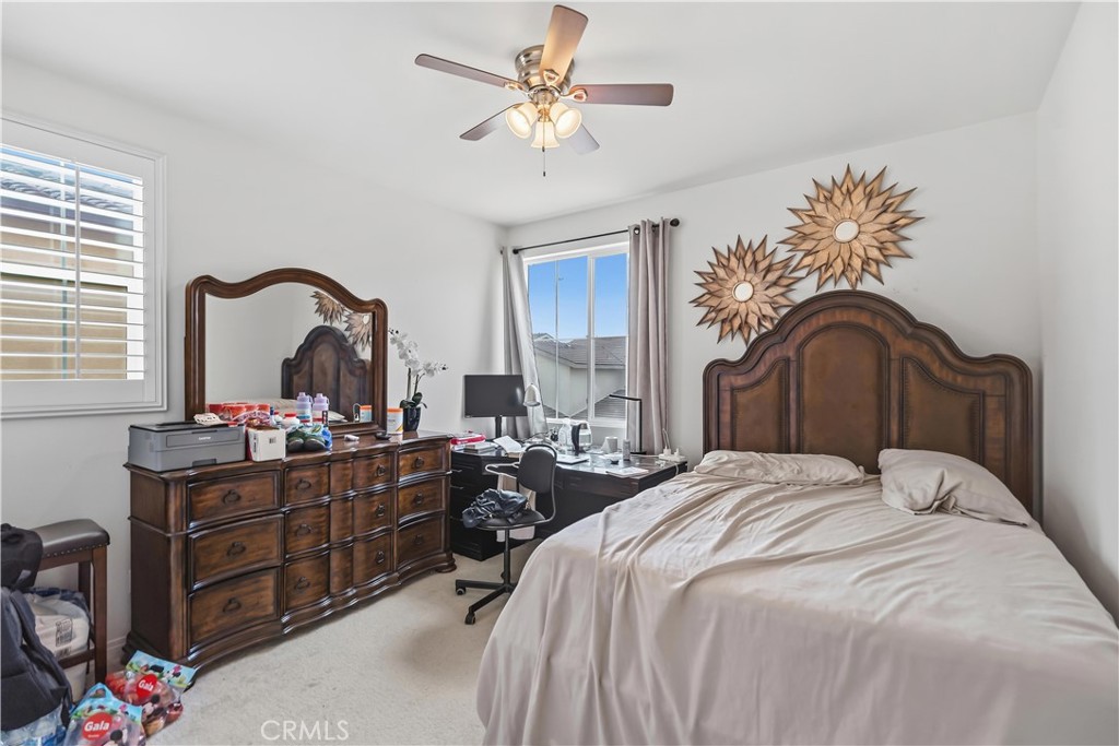 3380 Pine Ridge Loop Ontario, CA 91761 - Photo 23 of 37 a bedroom with a bed and a dresser