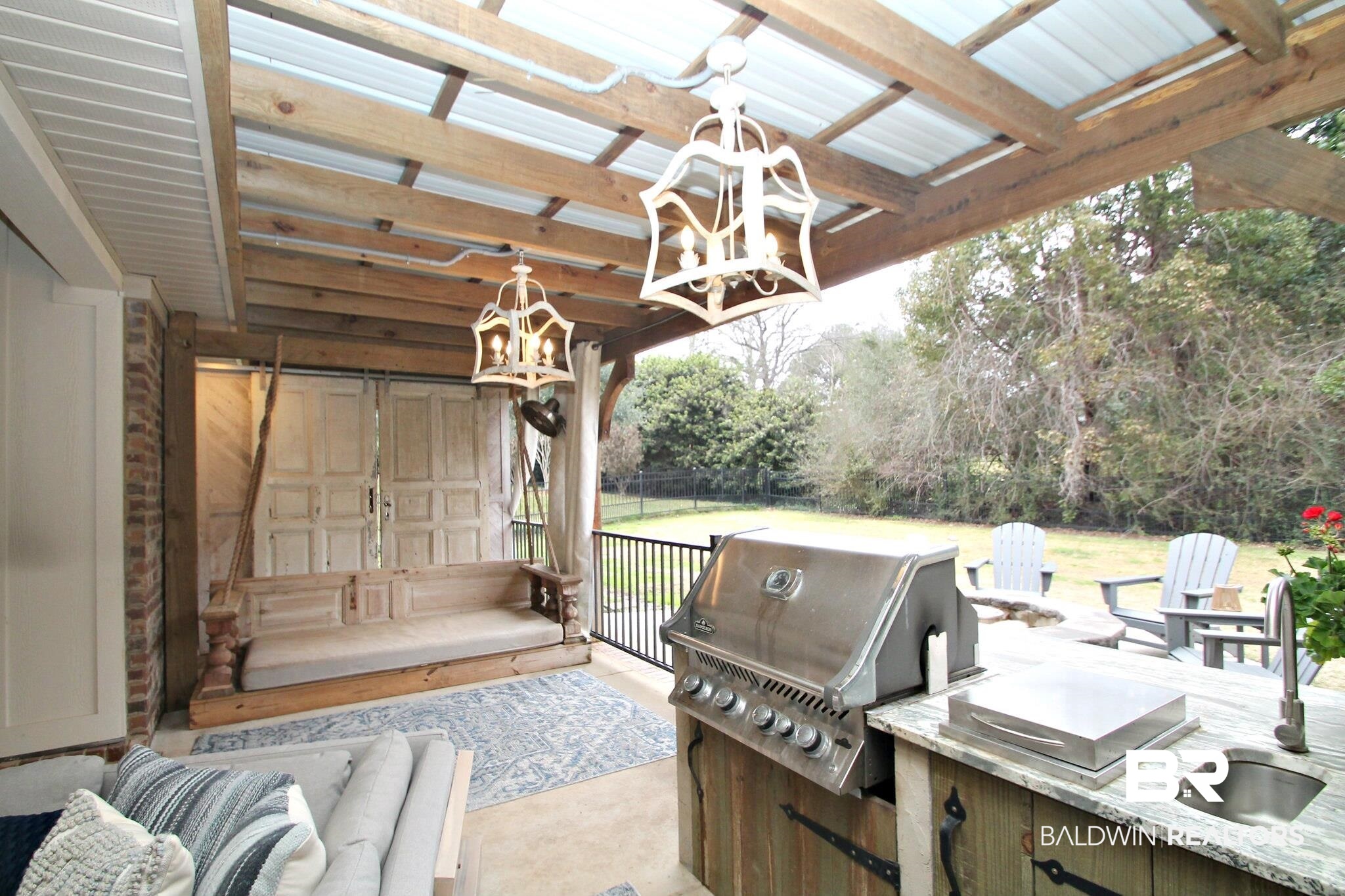 30232 Persimmon Drive Daphne, AL 36527 - Photo 23 of 27 Wooden terrace featuring grilling area, fence, an outdoor kitchen, and a sink