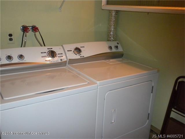 20 D Sycamore Access Road, Unit 4A Manahawkin, NJ 08050 - Photo 11 of 21 a utility room with dryer and washer