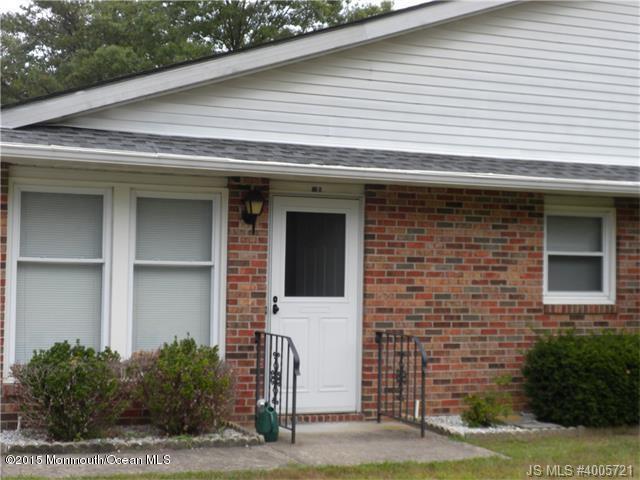20 D Sycamore Access Road, Unit 4A Manahawkin, NJ 08050 - Photo 15 of 21 a front view of a house with a yard