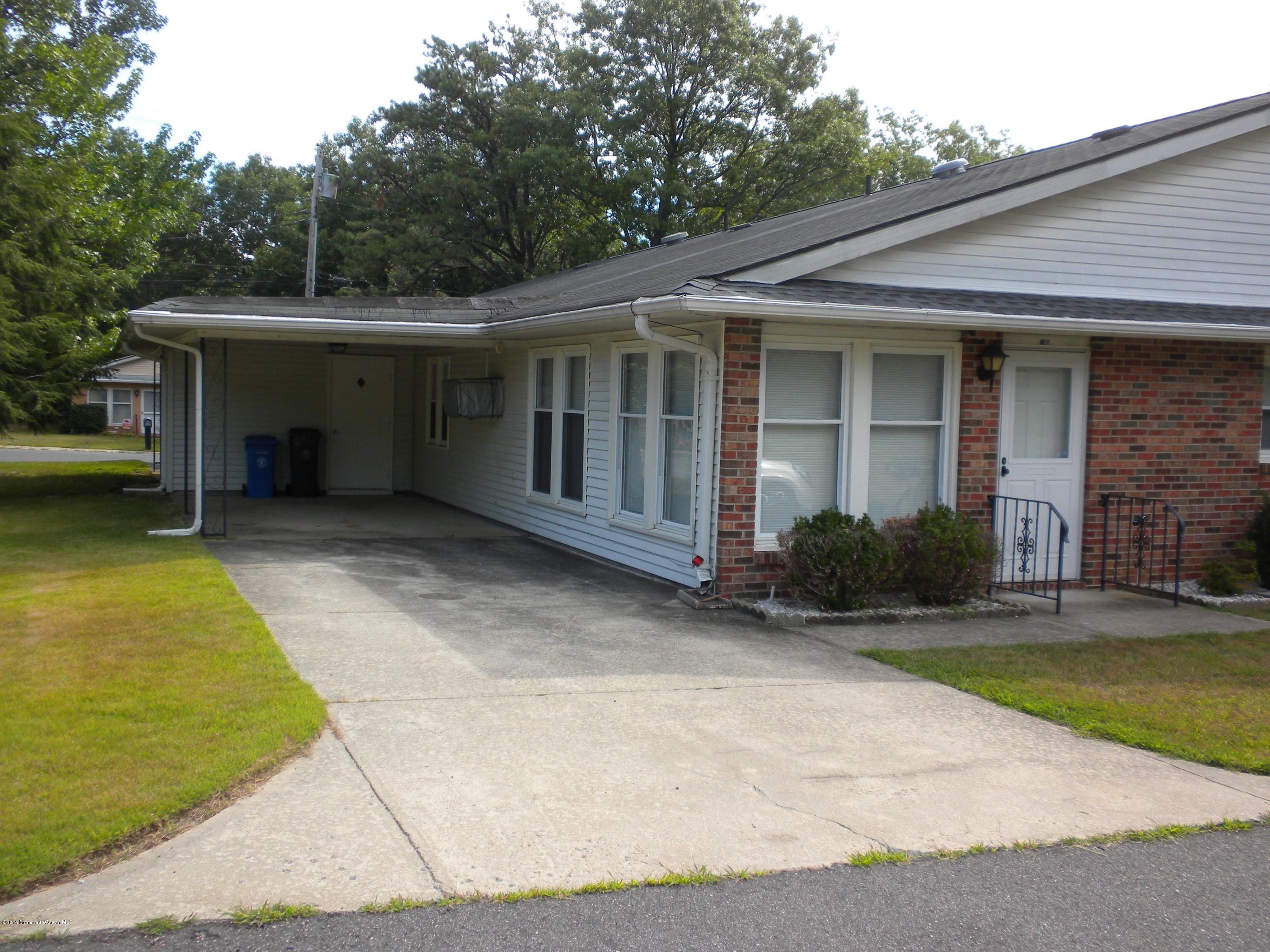 20 D Sycamore Access Road, Unit 4A Manahawkin, NJ 08050 - Photo 16 of 21 a view of a house with a garden