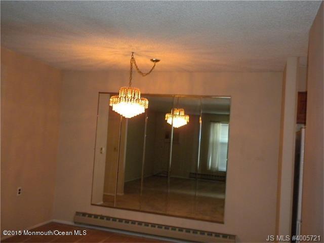 20 D Sycamore Access Road, Unit 4A Manahawkin, NJ 08050 - Photo 4 of 21 a bathroom with a mirror and a shower