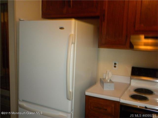 20 D Sycamore Access Road, Unit 4A Manahawkin, NJ 08050 - Photo 5 of 21 a bathroom with a sink and a mirror