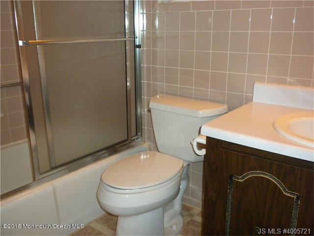 20 D Sycamore Access Road, Unit 4A Manahawkin, NJ 08050 - Photo 9 of 21 a bathroom with a toilet and a shower