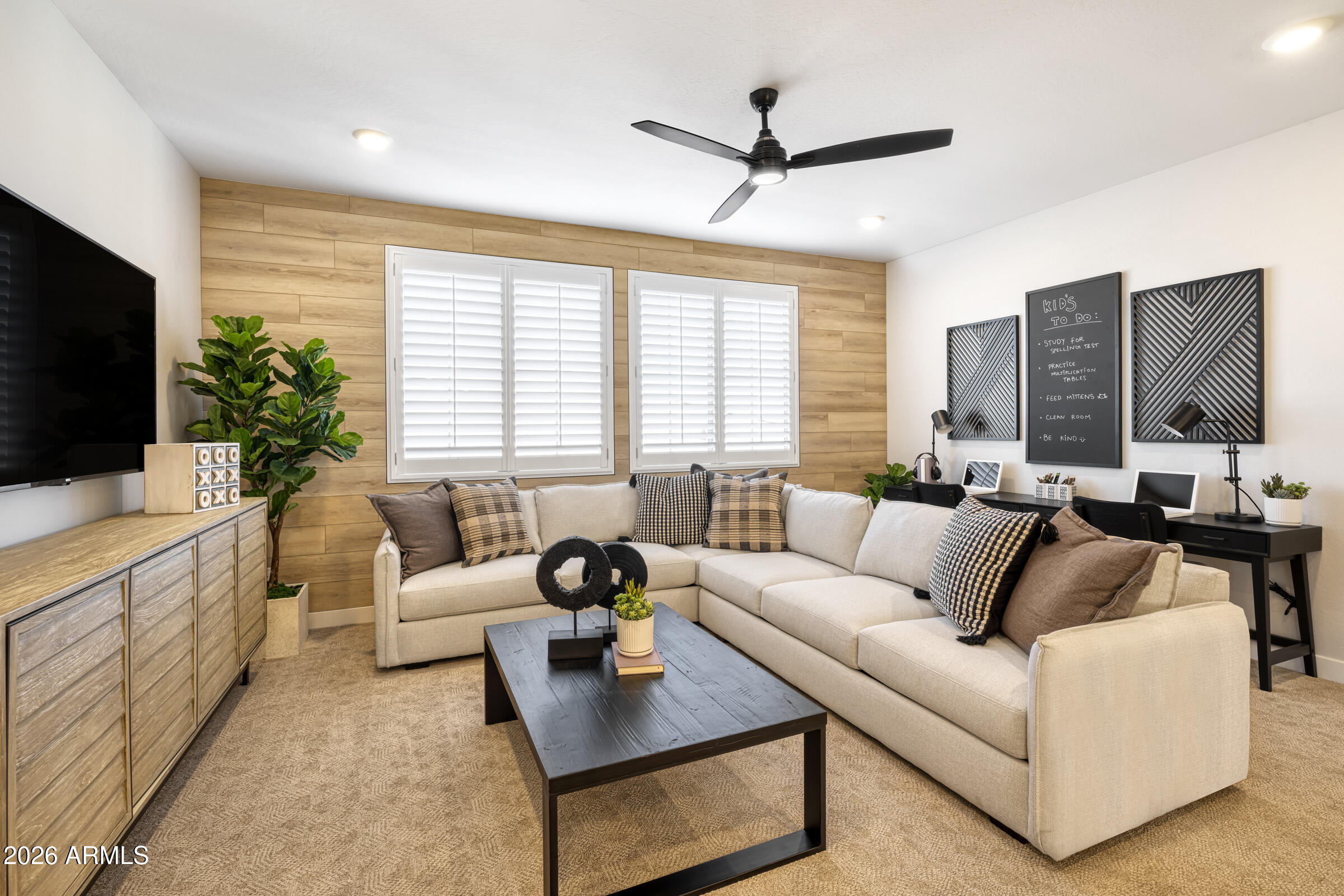 5729 South Quartz Street Gilbert, AZ 85298 - Photo 12 of 20 a living room with furniture and a flat screen tv