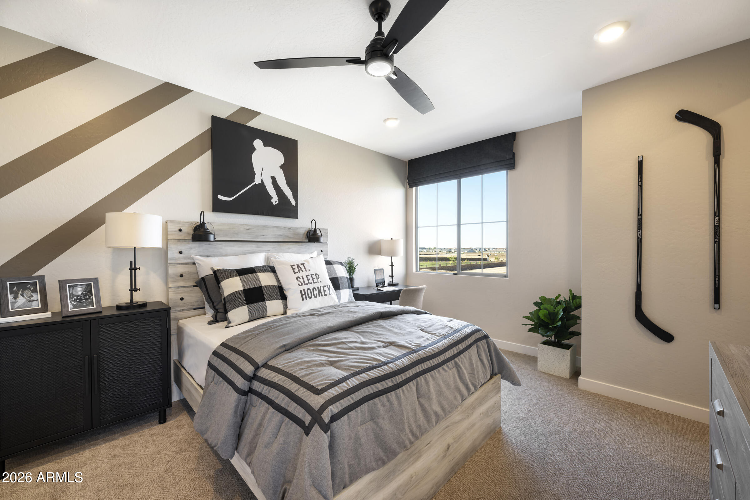 5729 South Quartz Street Gilbert, AZ 85298 - Photo 14 of 20 a bedroom with a bed a dresser and potted plants with the wooden floor