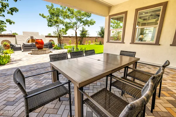 a view of a roof deck with furniture