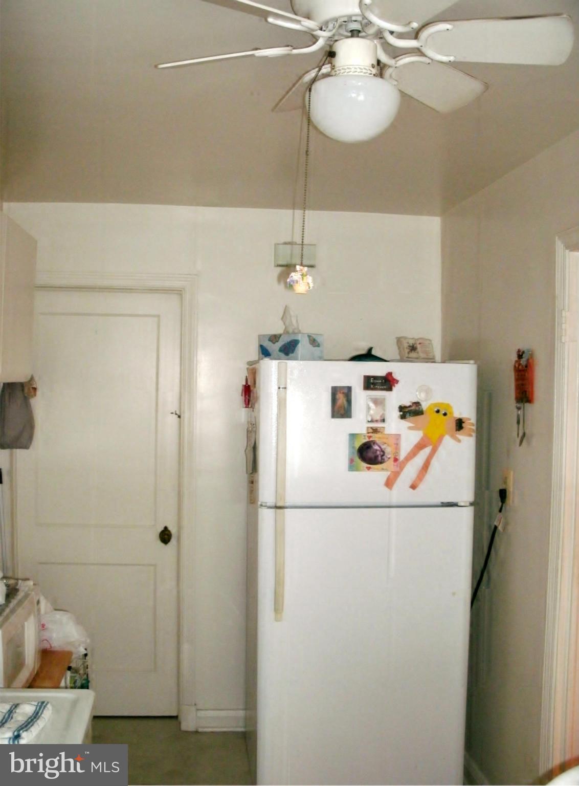 1944 Searles Road Baltimore, MD 21222 - Photo 6 of 17 Kitchen Refrigerator & Entry to Lower Level