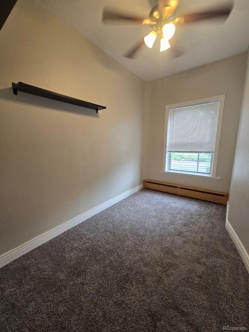 3127 West 28th Avenue, Unit 7 Denver, CO 80211 - Photo 6 of 11 an empty room with a window