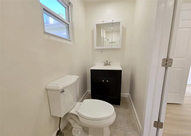 a bathroom with a toilet and a sink