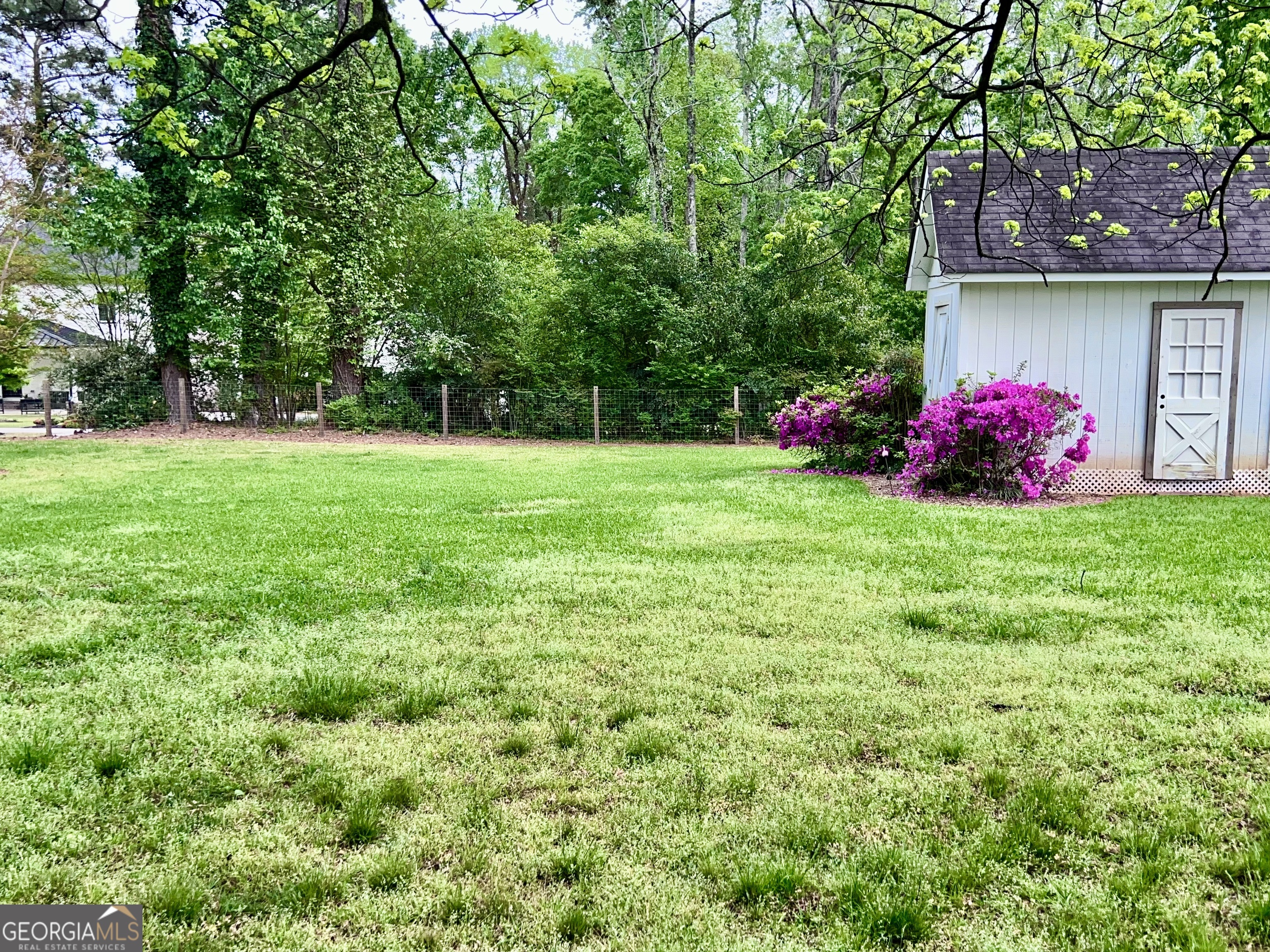 600 Foster Street Madison, GA 30650 - Photo 50 of 54 a view of a house with a big yard and potted plants