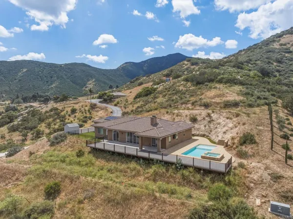a view of a house with a mountain