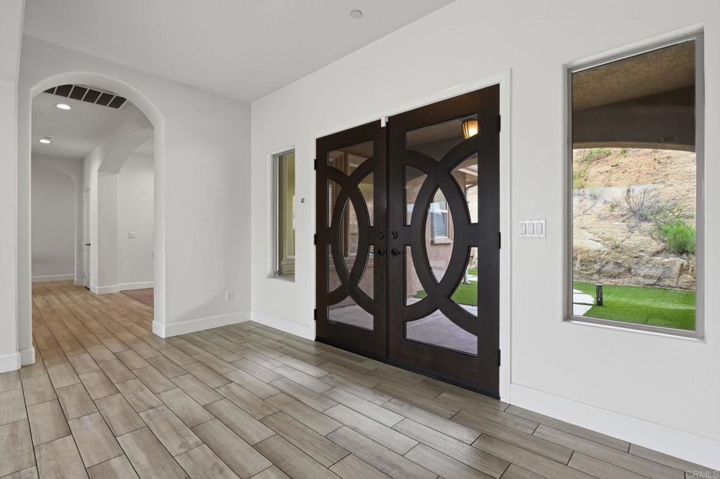 1910 Harbison Canyon Road El Cajon, CA 92019 - Photo 17 of 71 a view of a hallway with wooden floor and entryway