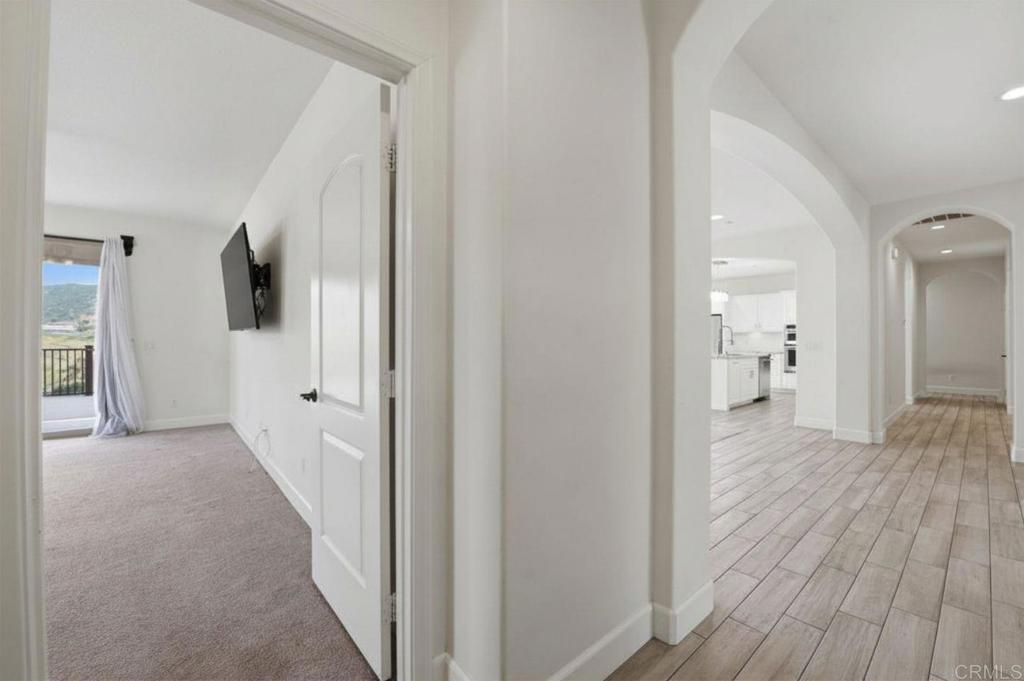 1910 Harbison Canyon Road El Cajon, CA 92019 - Photo 20 of 71 a view of a room with wooden floor and a bathroom